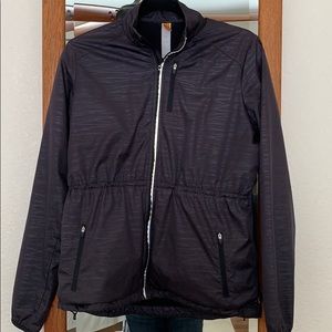 Lightweight cinch waisted windbreaker.